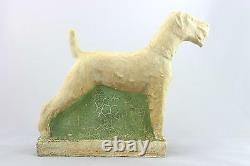 A vintage studio pottery sculpture of an Airedale Terrier. Signed. Art Deco era
