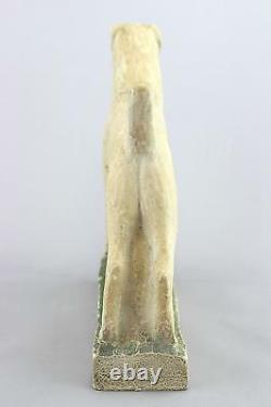 A vintage studio pottery sculpture of an Airedale Terrier. Signed. Art Deco era