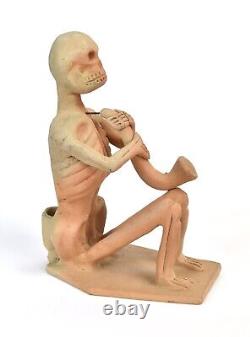 Vintage Studio Pottery Skeleton Playing Horned Instrument Candlestick