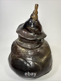 Vintage brutalist studio pottery seated Asian monk with pointed hat signed