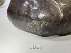 Vintage brutalist studio pottery seated Asian monk with pointed hat signed